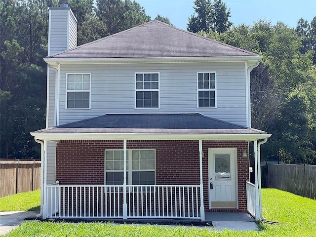 front facade featuring a front yard and a porch