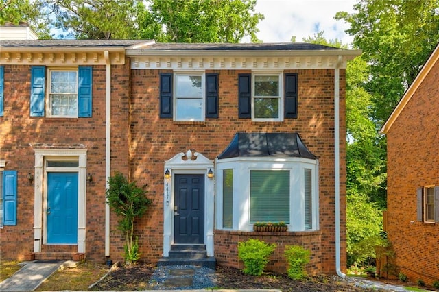 4417 Village Square Ln, Stone Mountain, GA 30083 - view of front of property with brick siding and a chimney