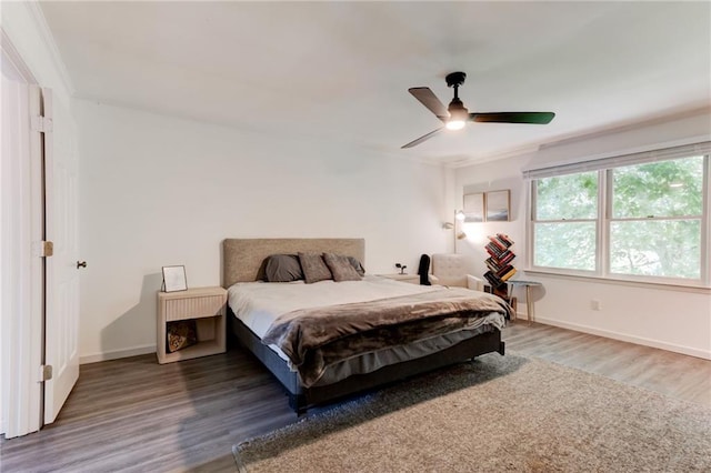 4417 Village Square Ln, Stone Mountain, GA 30083 - bedroom with wood finished floors, a ceiling fan, and ornamental molding
