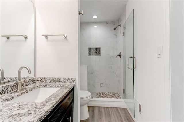 4417 Village Square Ln, Stone Mountain, GA 30083 - bathroom with a marble finish shower, vanity, and wood finished floors