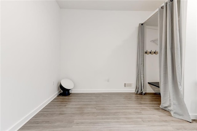 4417 Village Square Ln, Stone Mountain, GA 30083 - unfurnished bedroom with light wood-style floors and baseboards