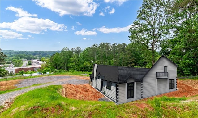196 Mountain Trce, Ellijay, GA 30540 - kitchen featuring stainless steel appliances, a sink, light stone countertops, and brown cabinets