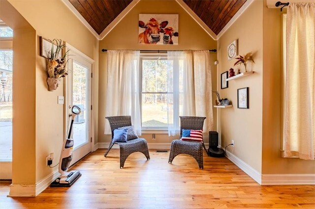 sitting room with wooden ceiling, high vaulted ceiling, and light hardwood / wood-style flooring