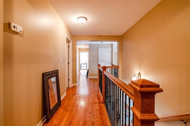 hall with light hardwood / wood-style floors