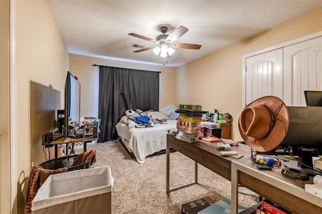 bedroom featuring ceiling fan and carpet floors