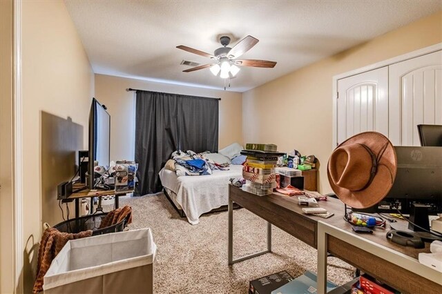 carpeted bedroom featuring ceiling fan