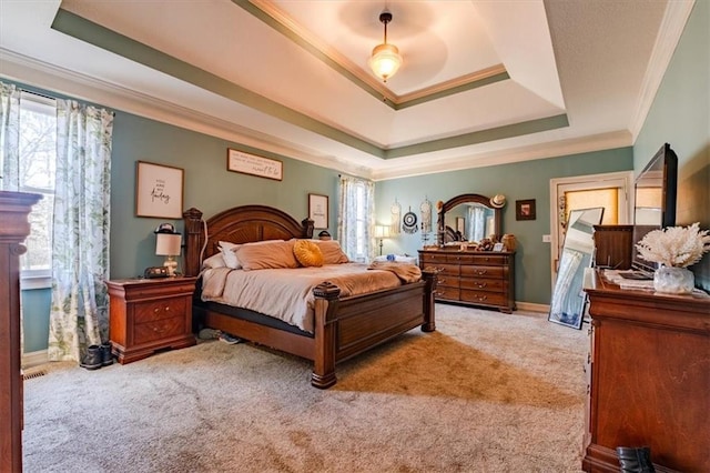 bedroom with a raised ceiling, ceiling fan, light colored carpet, and ornamental molding