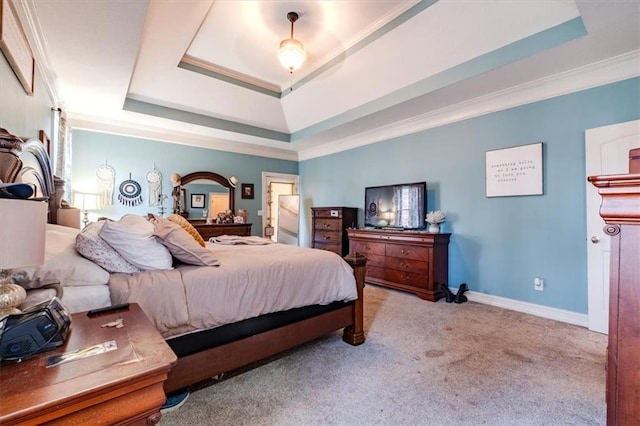 carpeted bedroom featuring a raised ceiling, ceiling fan, and crown molding