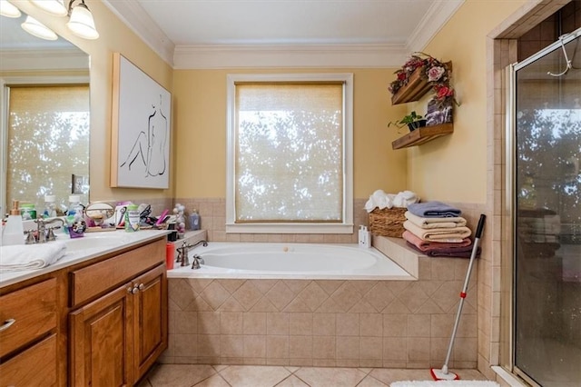 bathroom featuring tile patterned floors, crown molding, vanity, and shower with separate bathtub