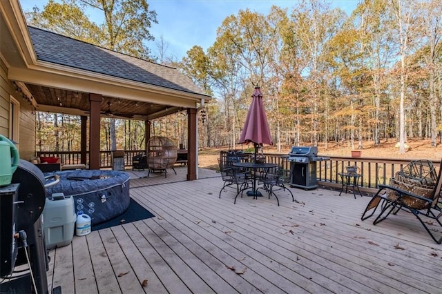 wooden deck featuring grilling area