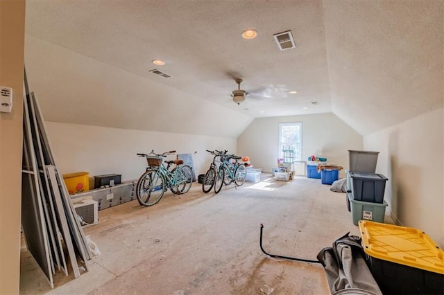 bonus room with a textured ceiling, ceiling fan, and lofted ceiling