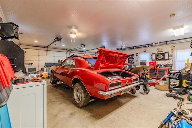 garage with washer / dryer and a garage door opener