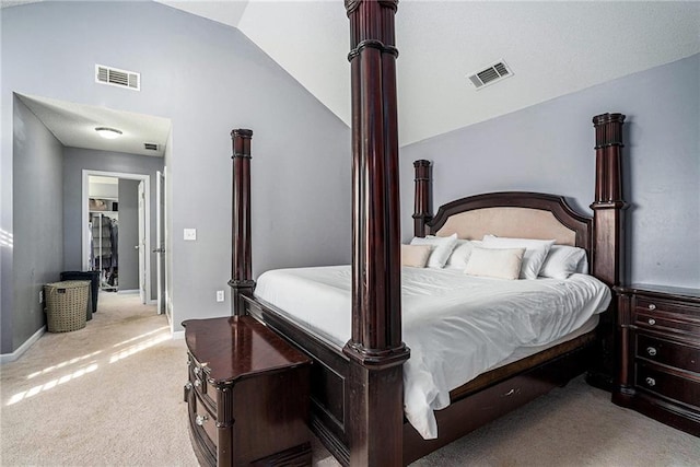 carpeted bedroom featuring vaulted ceiling