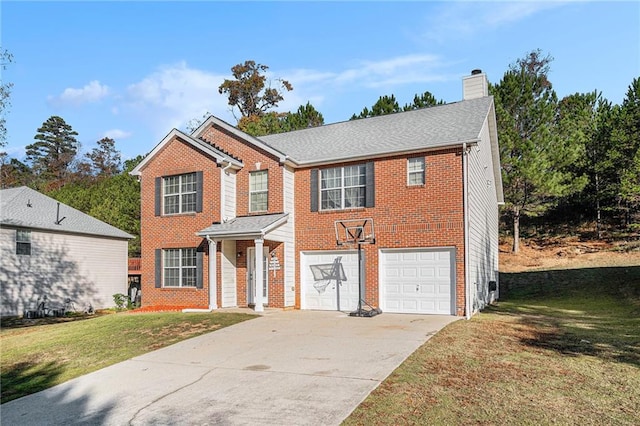 view of front of property with a garage and a front lawn