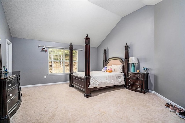 carpeted bedroom with vaulted ceiling