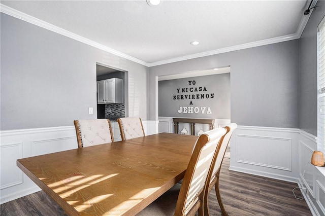 dining room featuring dark hardwood / wood-style flooring and ornamental molding