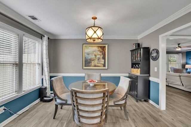3202 Ivy Station Way, Duluth, GA 30096 - dining room featuring light wood-style flooring, baseboards, crown molding, and a ceiling fan