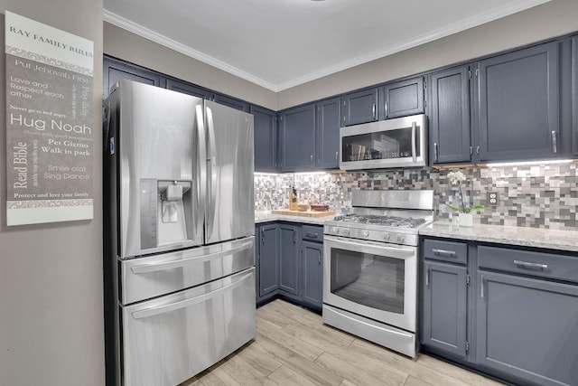 3202 Ivy Station Way, Duluth, GA 30096 - kitchen featuring appliances with stainless steel finishes, crown molding, decorative backsplash, light wood-style floors, and light stone countertops