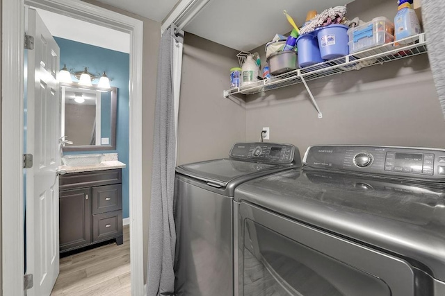 3202 Ivy Station Way, Duluth, GA 30096 - laundry area featuring light wood-style floors and washing machine and dryer