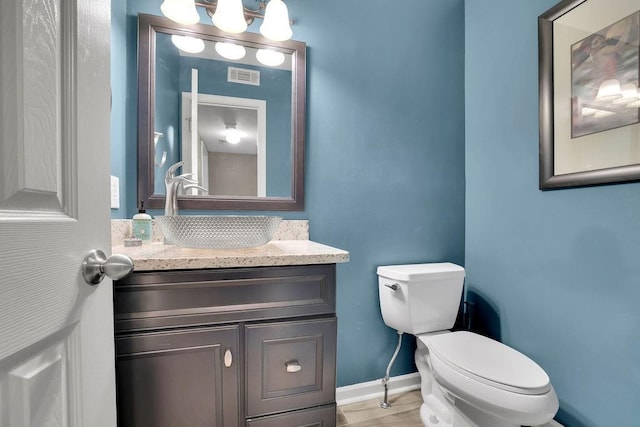 3202 Ivy Station Way, Duluth, GA 30096 - half bathroom featuring toilet, vanity, and baseboards