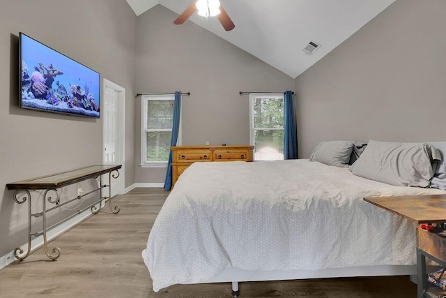 3202 Ivy Station Way, Duluth, GA 30096 - bedroom with high vaulted ceiling, wood finished floors, baseboards, and ceiling fan