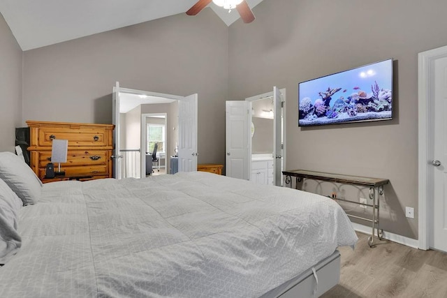 3202 Ivy Station Way, Duluth, GA 30096 - bedroom with high vaulted ceiling, wood finished floors, ensuite bath, ceiling fan, and baseboards