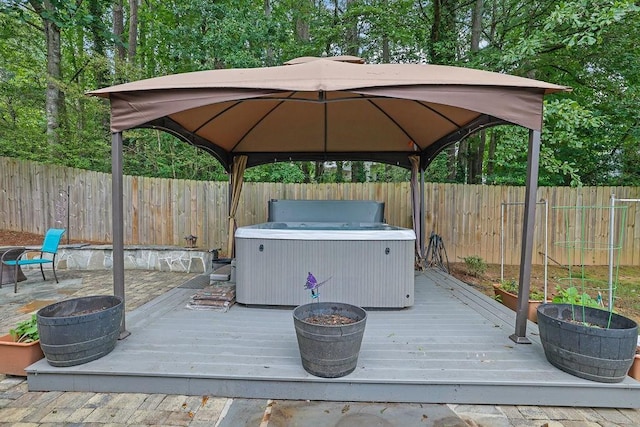 3202 Ivy Station Way, Duluth, GA 30096 - deck with a hot tub, a gazebo, and a fenced backyard