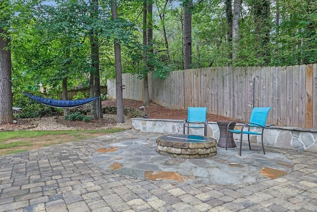 3202 Ivy Station Way, Duluth, GA 30096 - fenced backyard featuring an outdoor fire pit and a patio