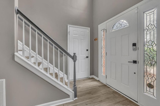 3202 Ivy Station Way, Duluth, GA 30096 - entrance foyer with stairway, wood finished floors, and a towering ceiling