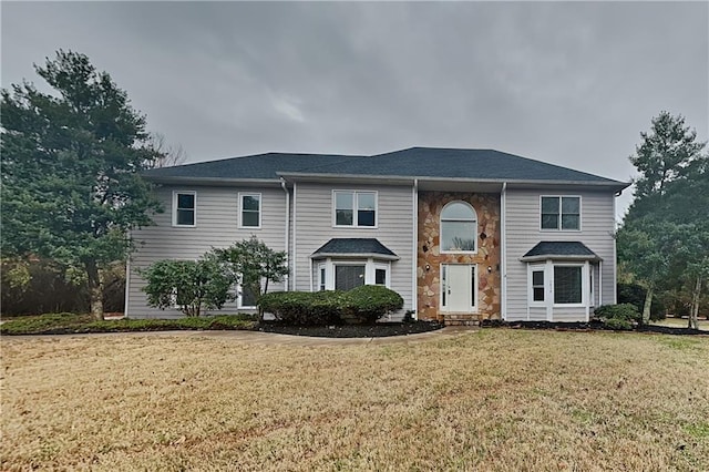 view of front of home with a front yard