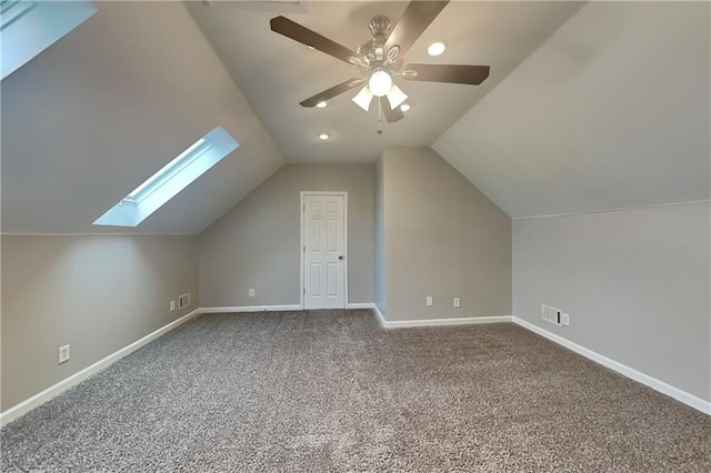 additional living space with carpet flooring, vaulted ceiling, and ceiling fan