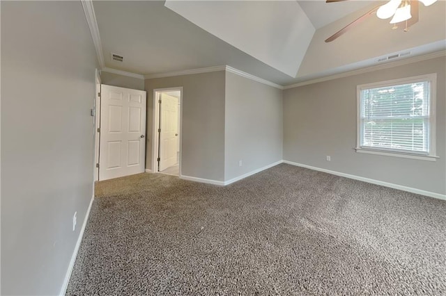 spare room featuring ceiling fan, crown molding, vaulted ceiling, and carpet floors