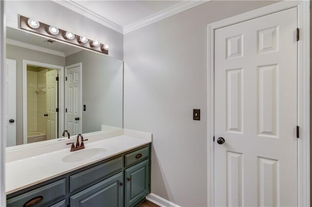 bathroom with vanity and ornamental molding