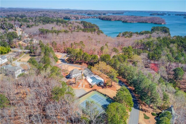 bird's eye view with a water view and a view of trees