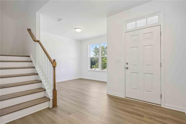 entryway with light hardwood / wood-style flooring