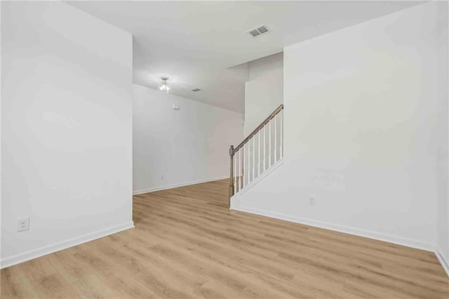 empty room with light hardwood / wood-style floors