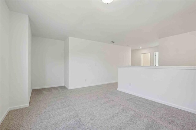 spare room with light colored carpet