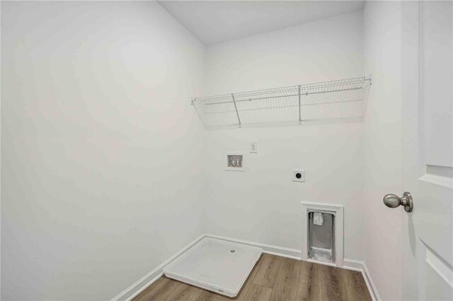 laundry area featuring washer hookup, electric dryer hookup, and wood-type flooring