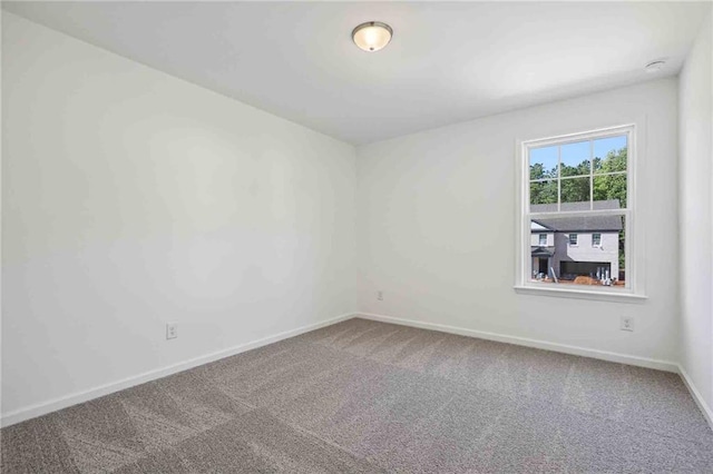 unfurnished room featuring carpet floors