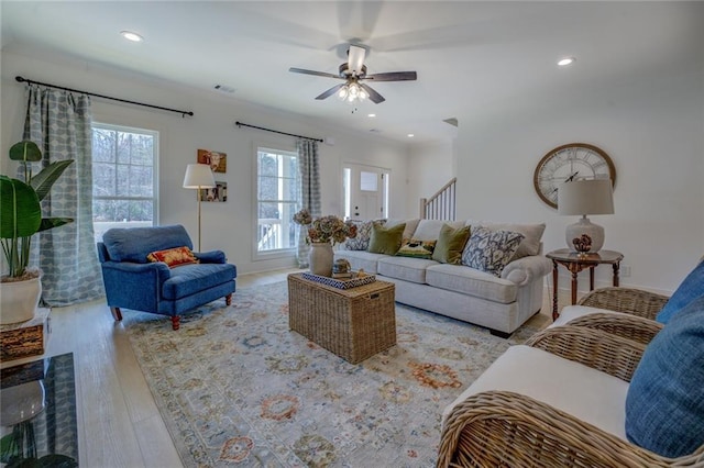 living area featuring healthy amount of natural light, ceiling fan, wood finished floors, and recessed lighting