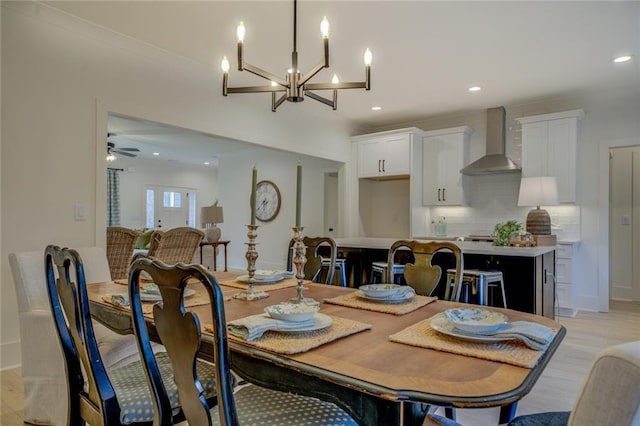 dining area with light wood-style flooring, a chandelier, recessed lighting, ceiling fan, and baseboards
