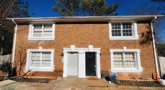 view of front of home featuring brick siding