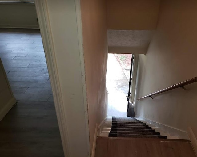 stairs with wood finished floors