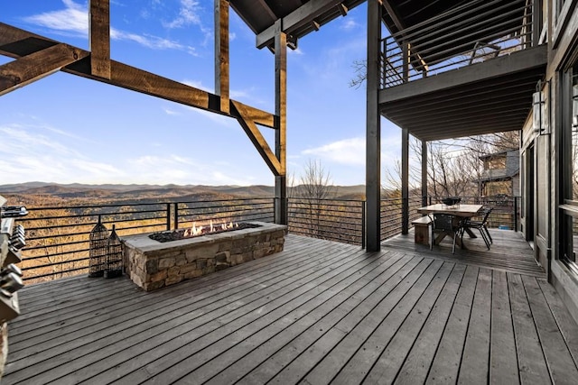 wooden deck featuring a mountain view