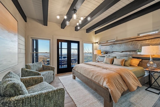 bedroom with french doors, wood ceiling, light hardwood / wood-style flooring, access to outside, and beamed ceiling