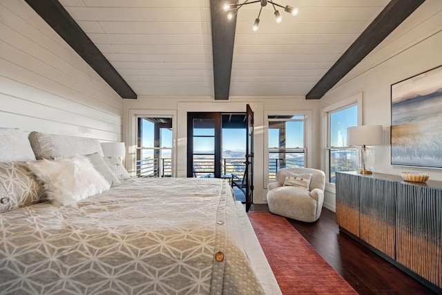 bedroom featuring dark hardwood / wood-style flooring, lofted ceiling with beams, multiple windows, and access to outside