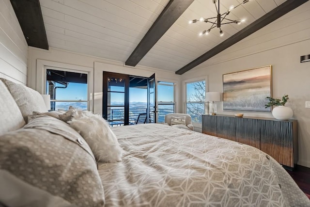 bedroom with a water view, a notable chandelier, lofted ceiling with beams, and access to outside