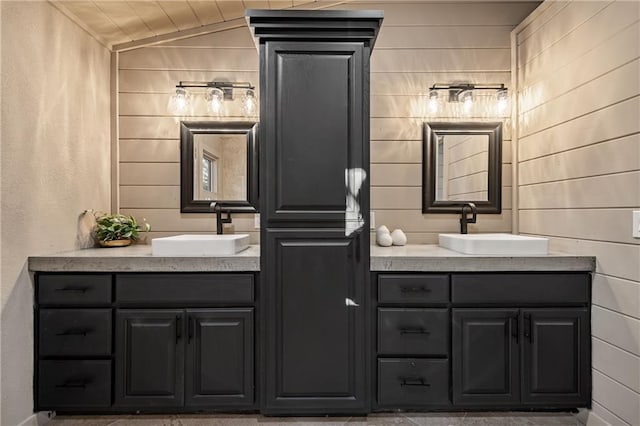 799 Bruce Mountain Rd, Morganton, GA 30560 - bathroom featuring two vanities, lofted ceiling, and wood walls