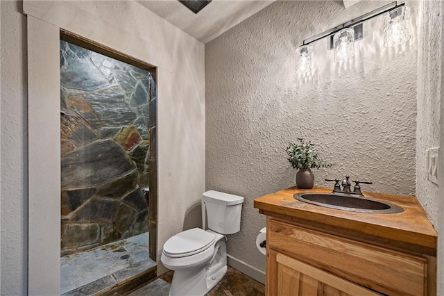 799 Bruce Mountain Rd, Morganton, GA 30560 - bathroom featuring toilet, a shower stall, vanity, a textured wall, and baseboards