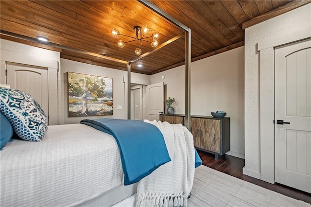 799 Bruce Mountain Rd, Morganton, GA 30560 - bedroom with wooden ceiling, wood finished floors, a chandelier, and baseboards